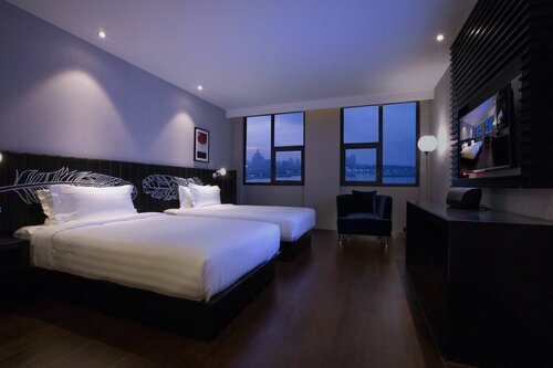 Гостиница Orange Crystal Hotel Wusi Square Seaview в Циндао