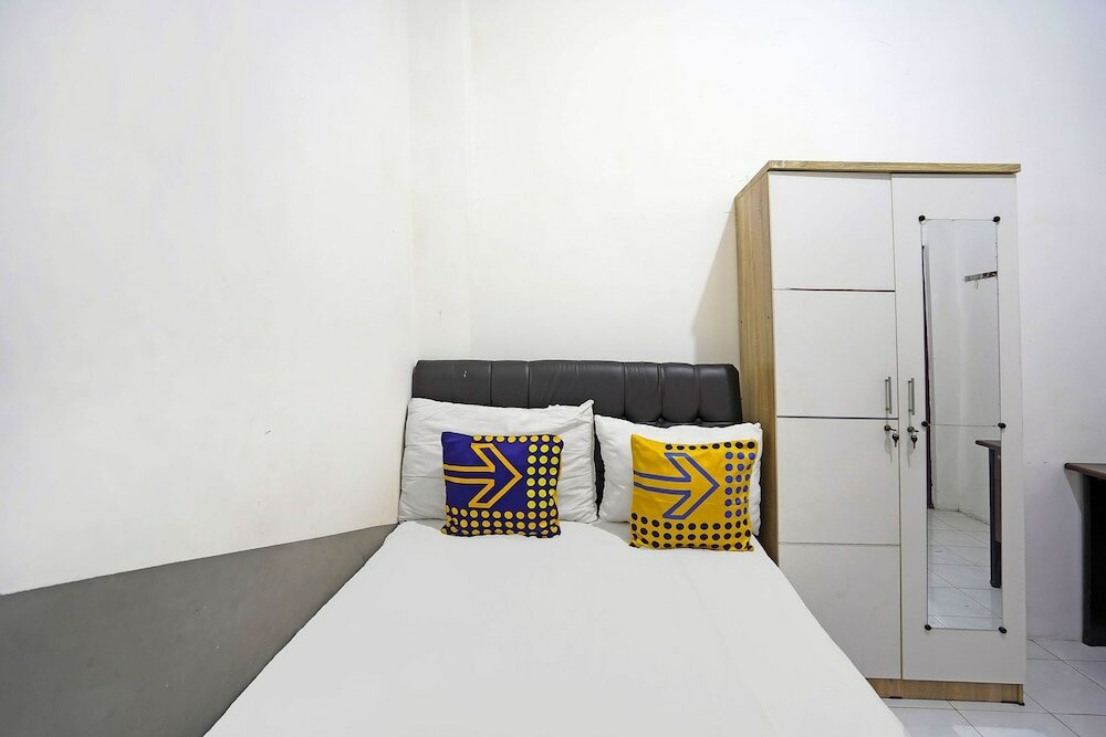 Фото Spot On 91360 Swk 68 Syariah