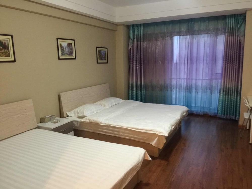 Фото Dalian Aolai Hotel Apartment