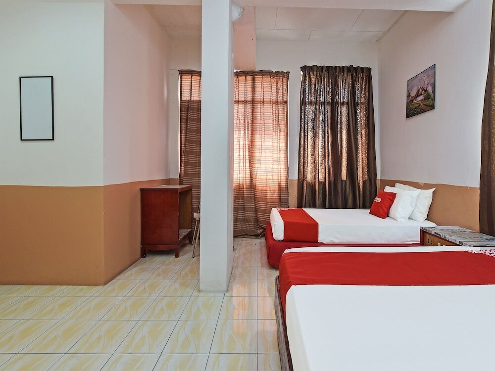 Фото Super Oyo Capital O 90659 Raintown Timbers Hotel