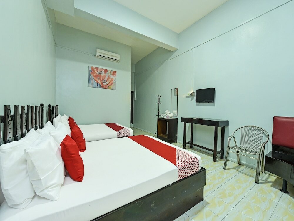 Фото Super Oyo Capital O 90659 Raintown Timbers Hotel