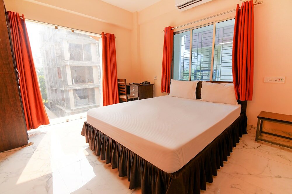 Фото Fabhotel Ashraya Inn