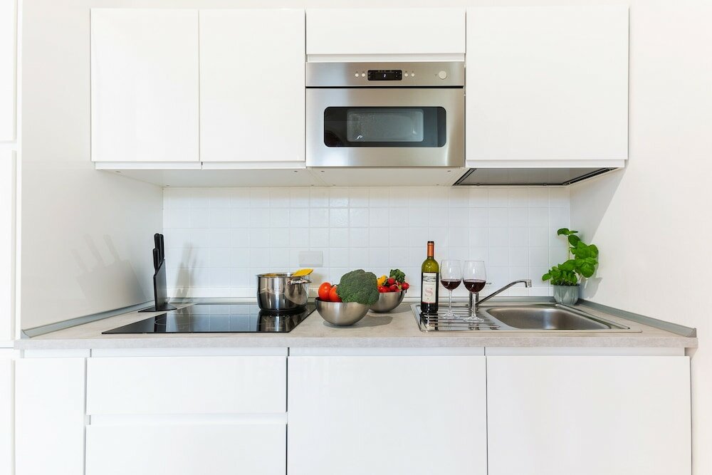 Фото University Apartment con parcheggio e giardino