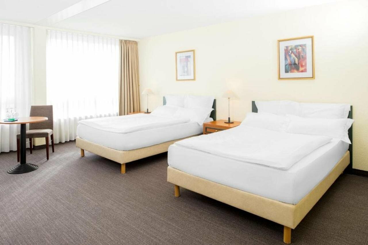 Фото Nh Fribourg Hotel