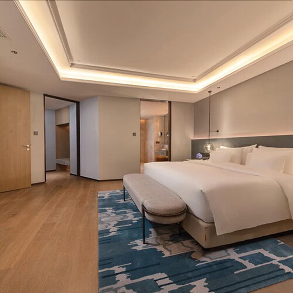 Фото New Century Hotel Zhenhai