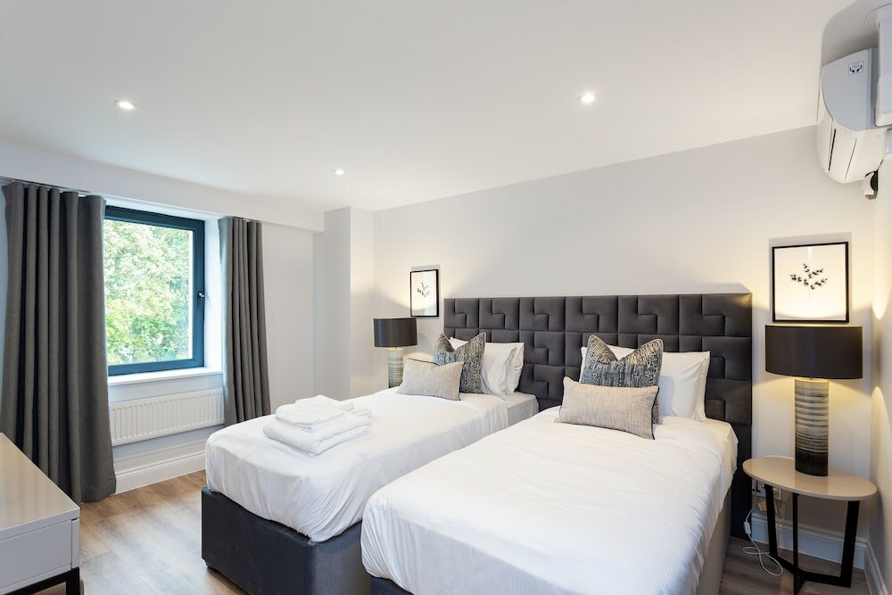 Фото The Carlyle - Elegant Serviced Apartments