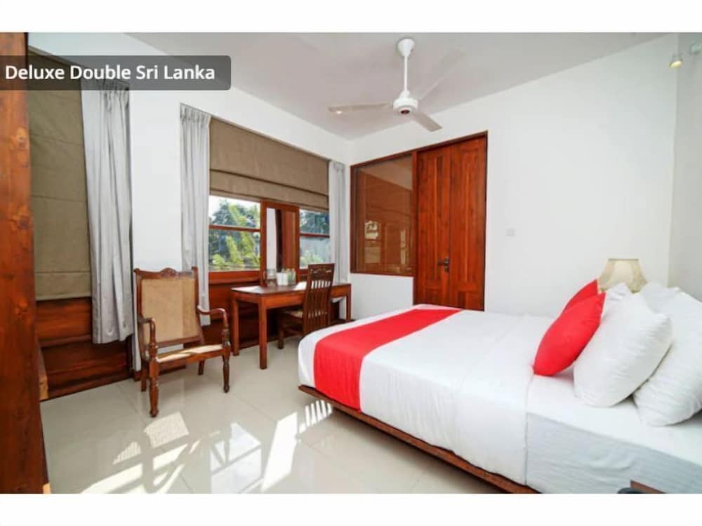 Фото Oyo 557 De Mansion