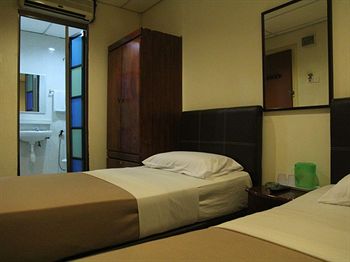 Фото Oyo 615 Dragon Inn Premium Hotel