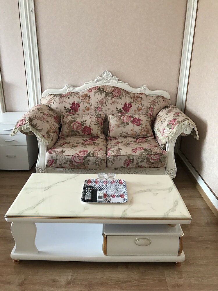 Фото Dalian Xuanya Apartment