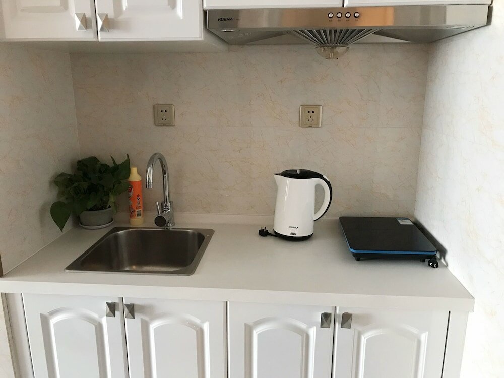 Фото Dalian Xuanya Apartment