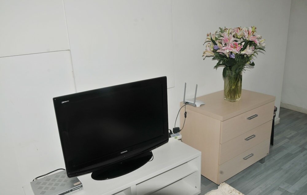 Фото Dalian Xiuzhu Building Apartment