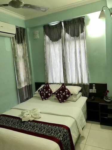 Гостиница Coral Queen Inn в Мале