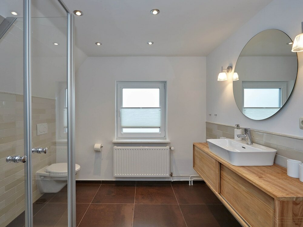 Фото Ferienhaus & Appartments Düneneck 8