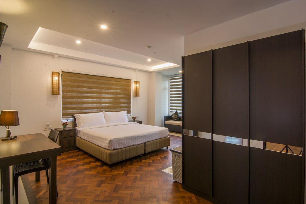 Фото Woodside Inn & Serviced Apartments
