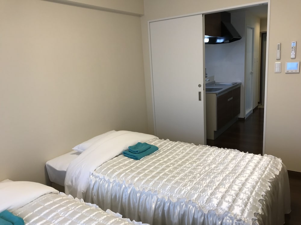 Фото Weekly Harbor View Mansion Ginowan