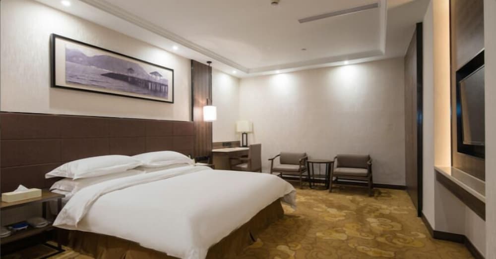 Фото Auden International Hotel