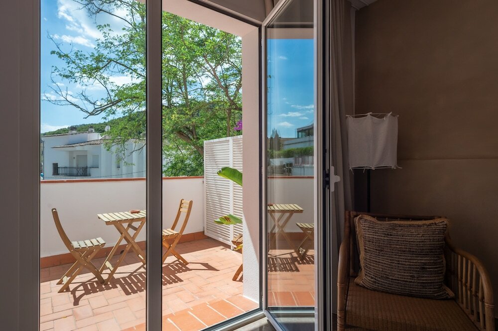 Фото Hostal Es Niu de Tamariu