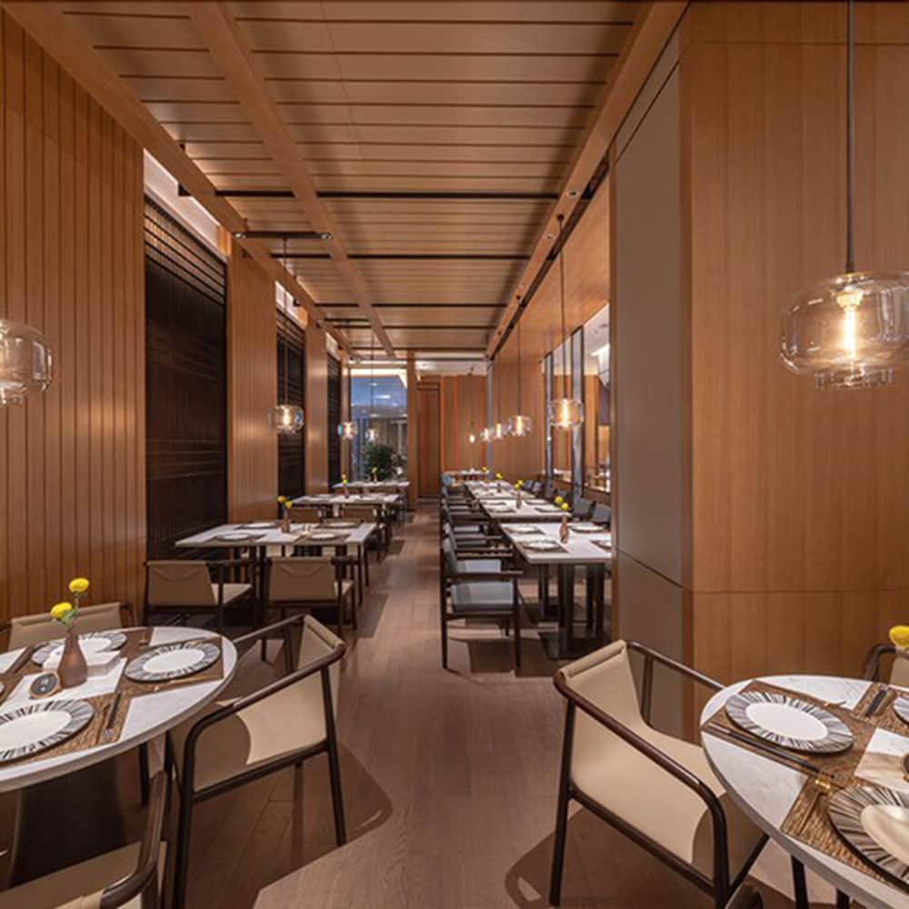 Фото New Century Hotel Zhenhai