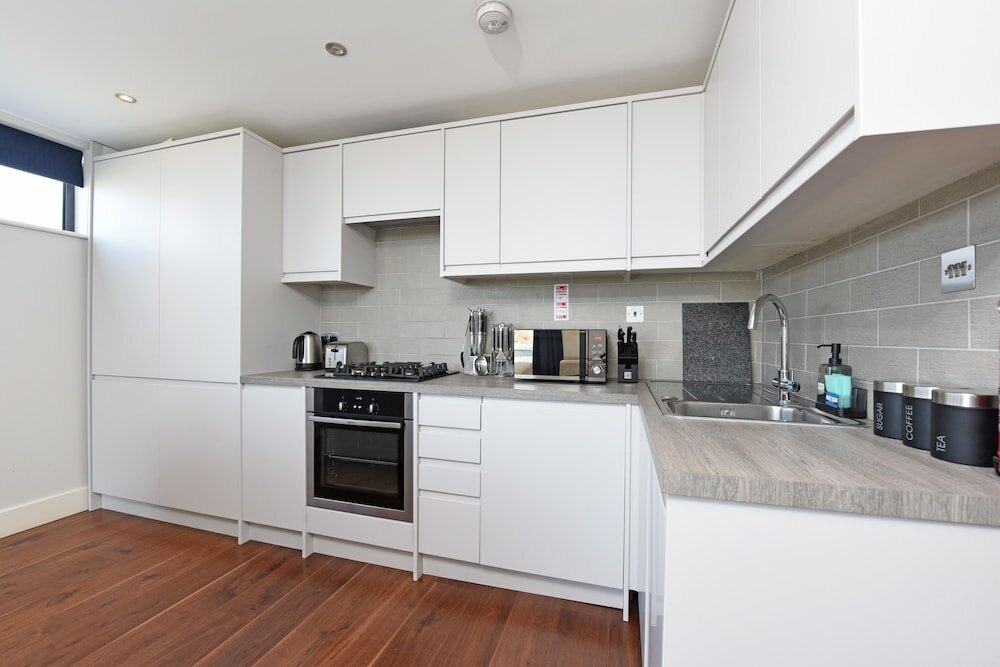 Фото The Glasshouse Apartments