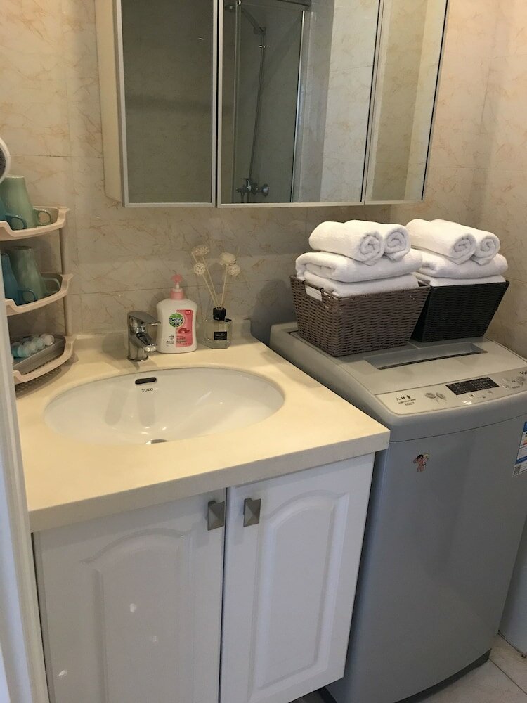 Фото Dalian Xuanya Apartment