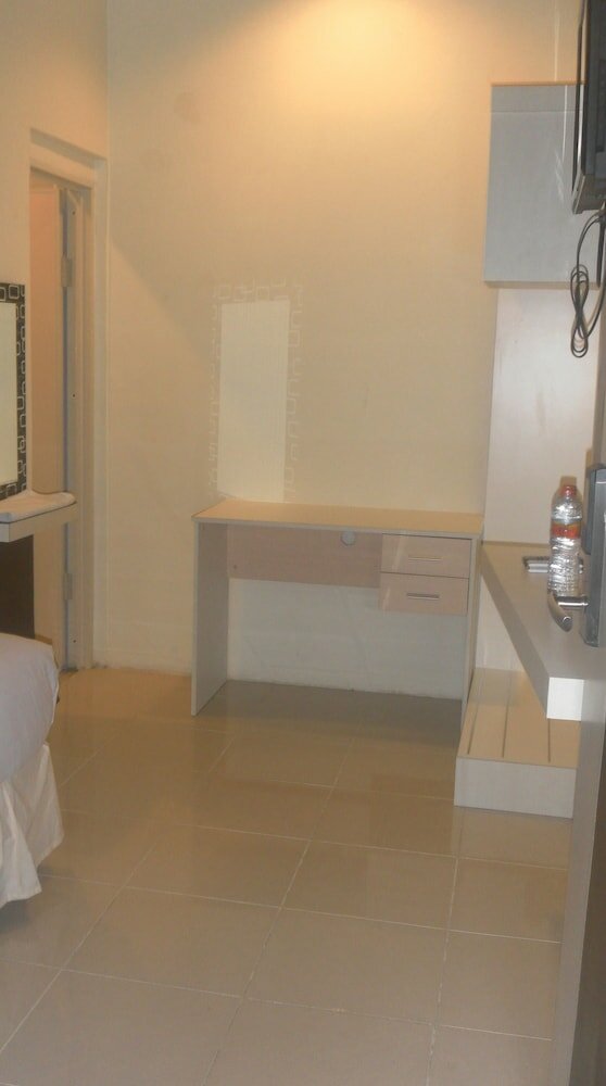 Фото Harmoni Inn Pelabuhan Makassar