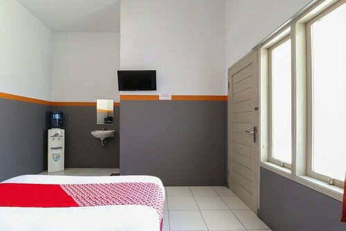 Гостиница Wisma Etiga by Oyo Rooms в Гаруте