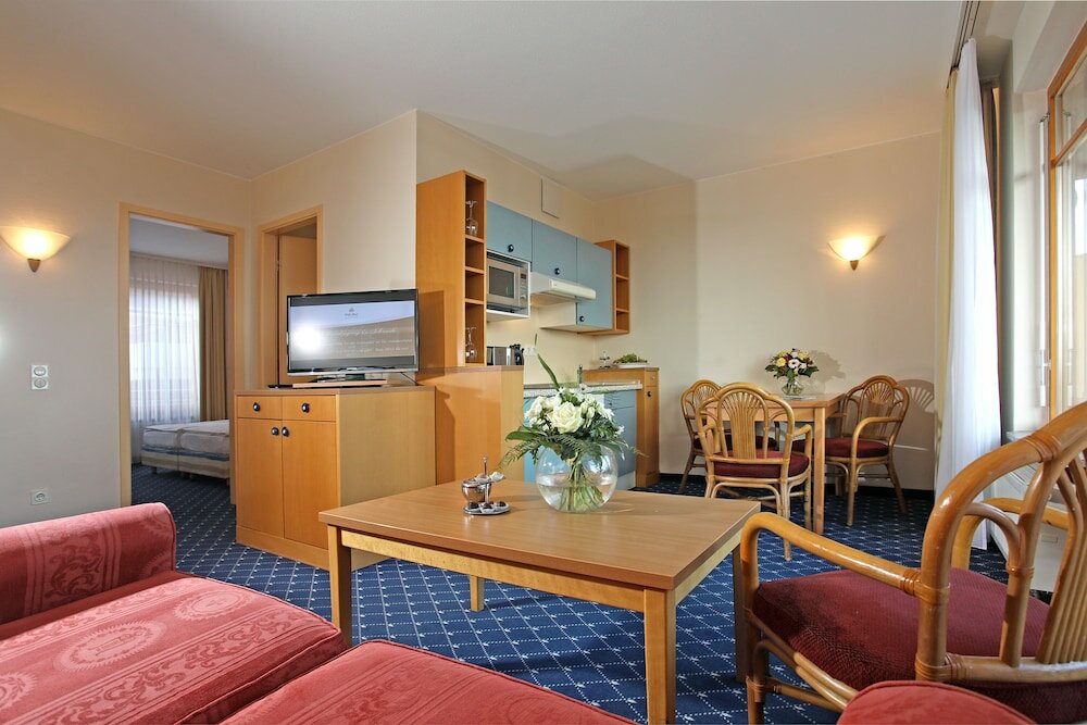 Фото Cliff Wellness Ferienwohnungen Ruegen