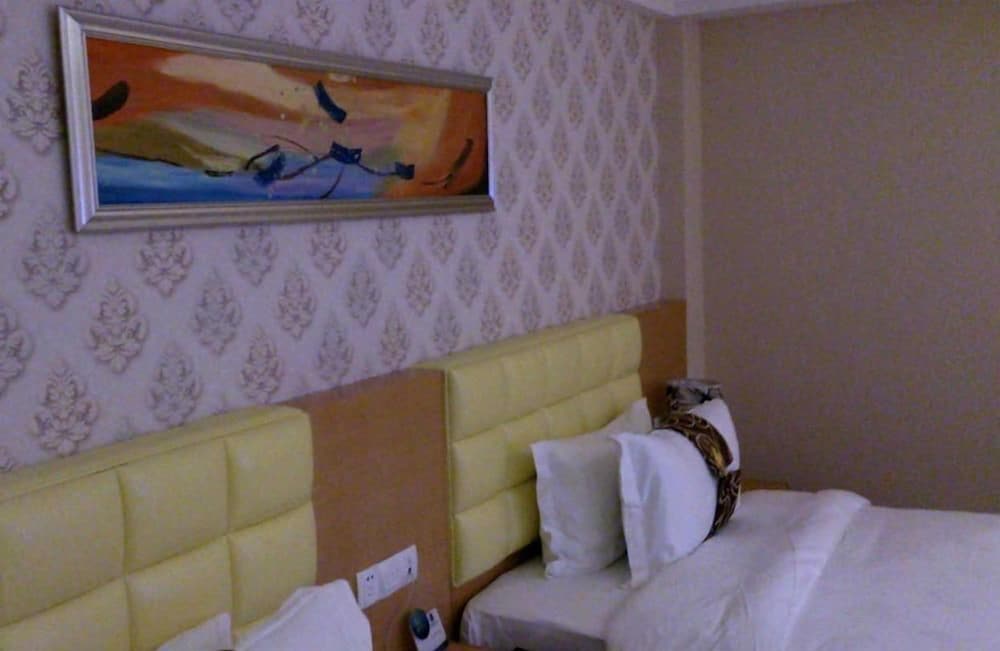 Фото New Beacon Xu Dong International Hotel