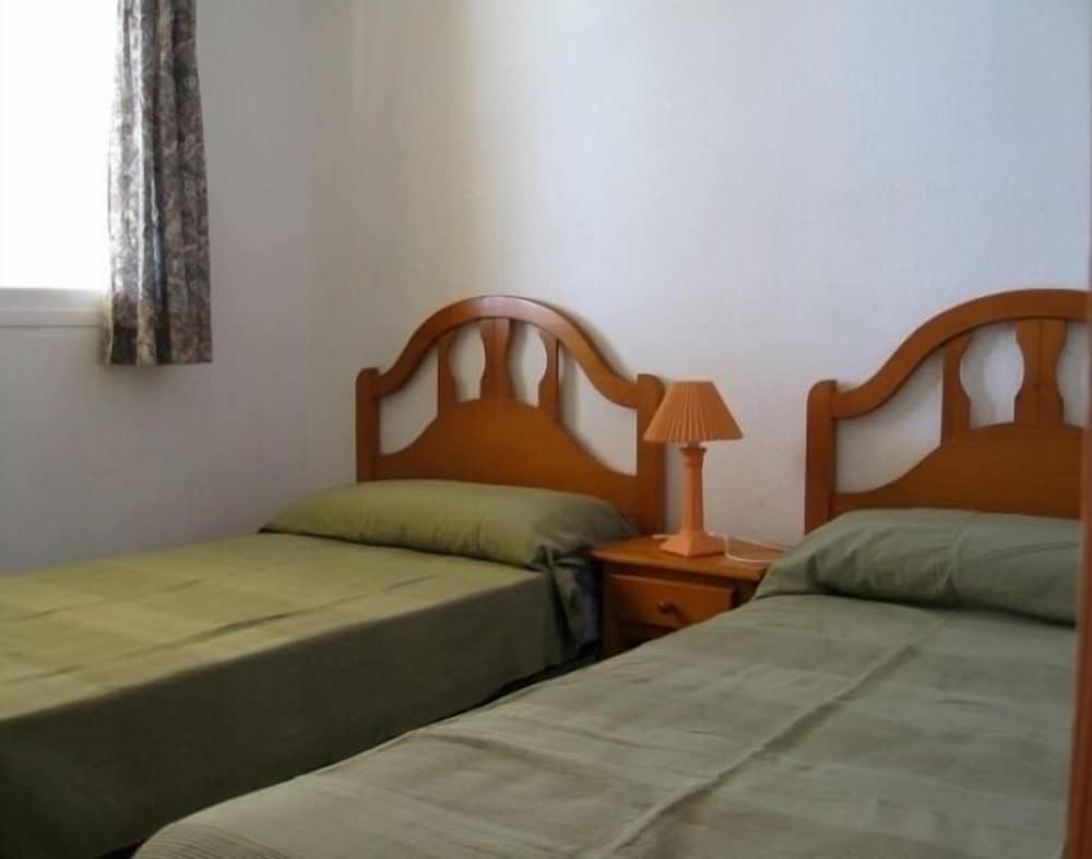 Фото Apartamentos la Reina