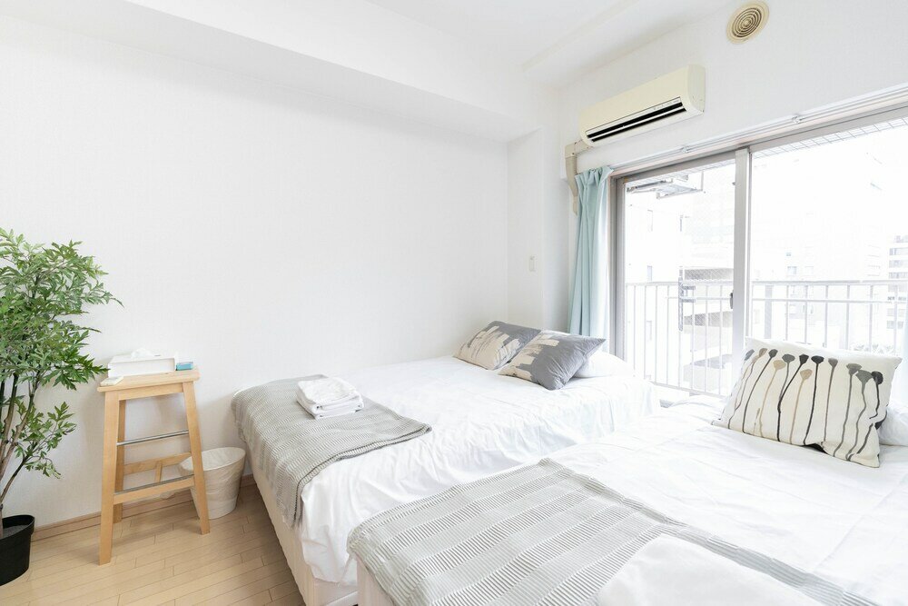 Фото Shinsaibash East Nana Apartment · Junan