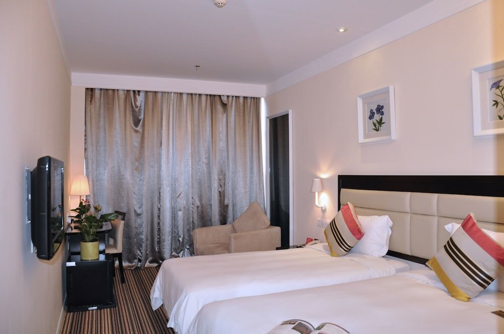 Фото KaiMan Hotel