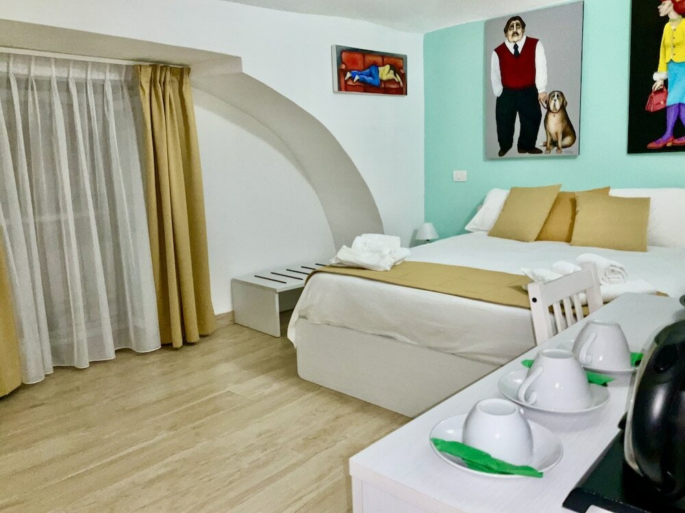 Фото A Room de Scugnizzi