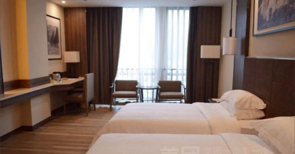 Фото Auden International Hotel