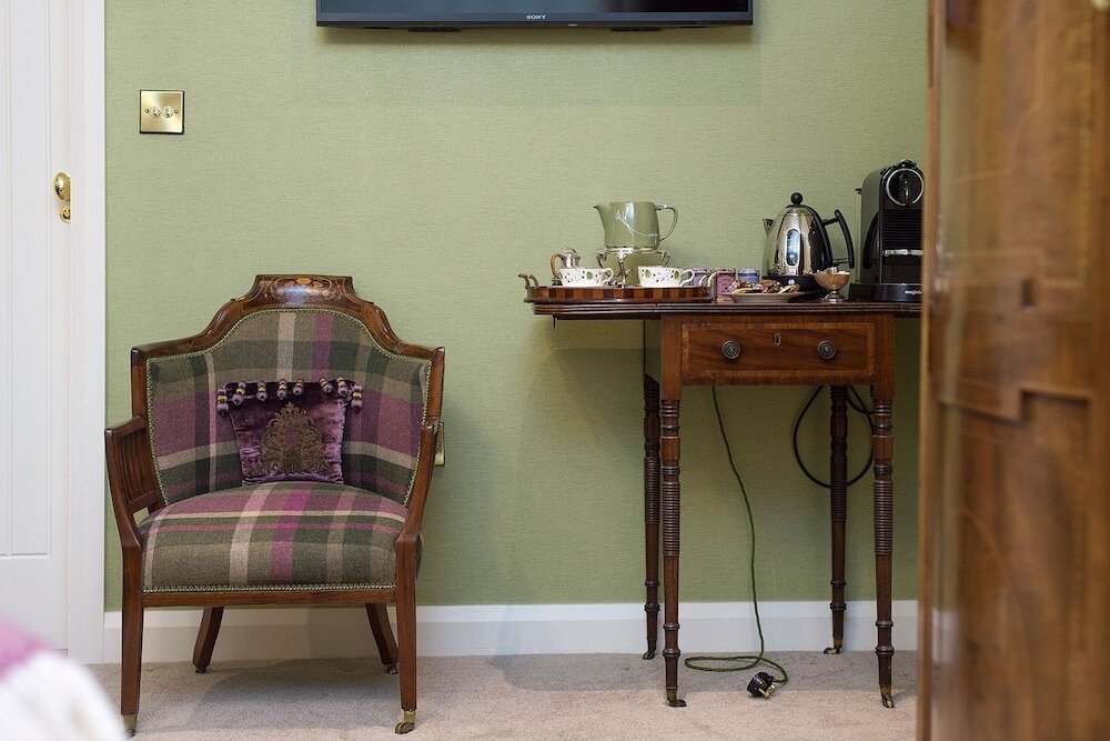 Фото Coach House Boutique B&b