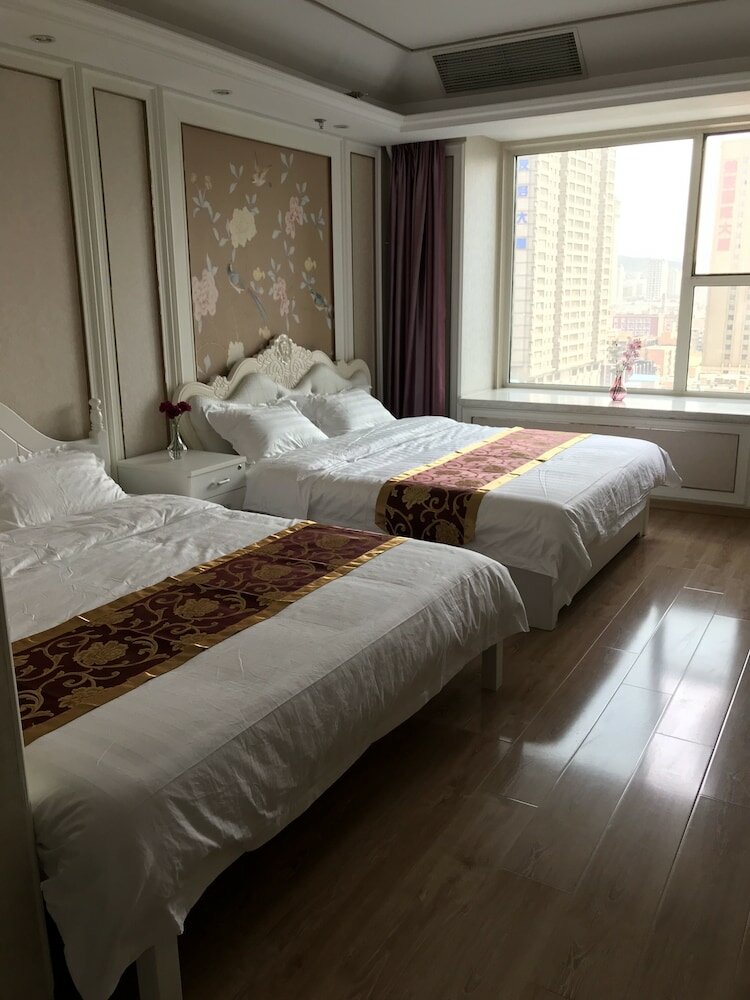 Фото Dalian Xuanya Apartment