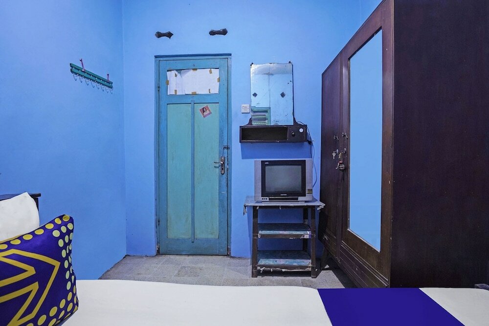 Фото Spot On 91859 Kost Budhe Syariah