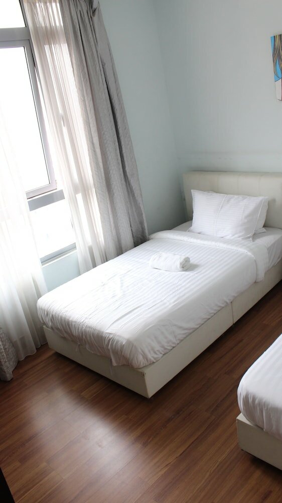 Фото Peaceful Service Suites at Taragon Puteri Bintang