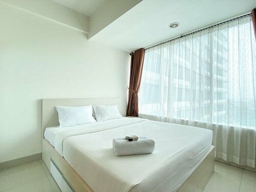 Гостиница Modern and Spacious Studio with City View @ Grand Kamala Lagoon Apartment в Бекаси
