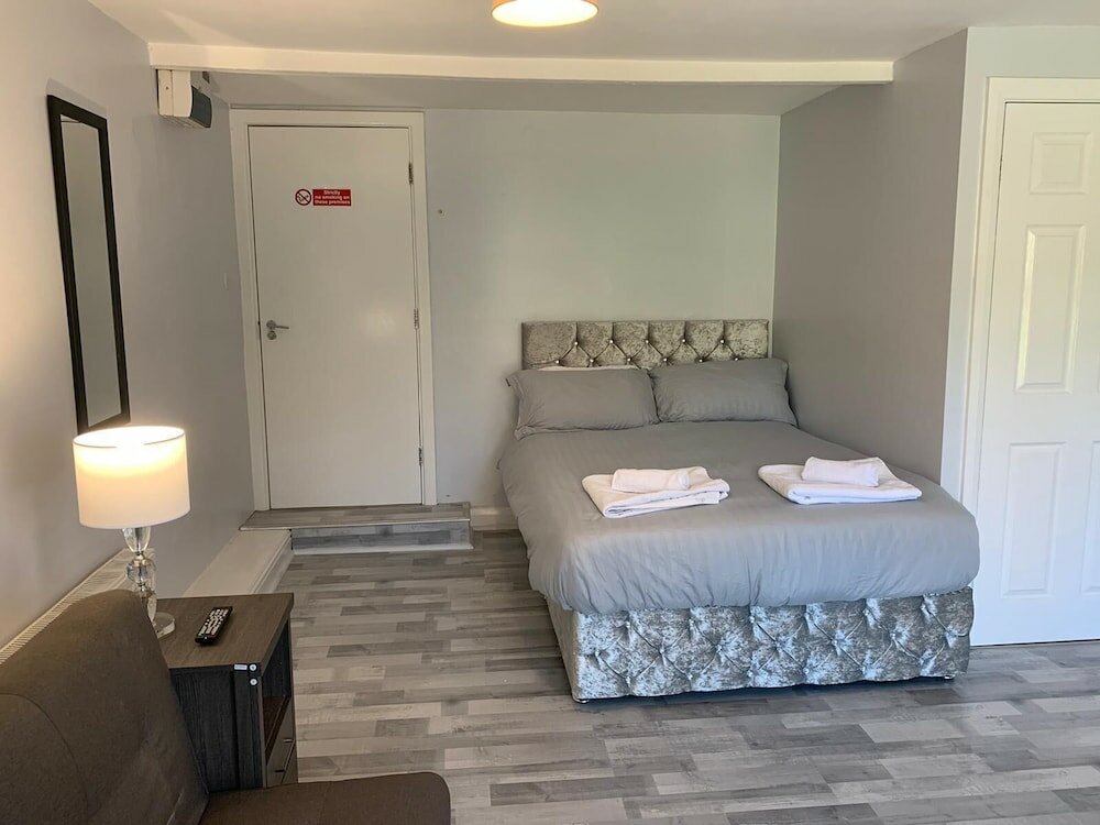 Фото Grey Stone Studio Apartments