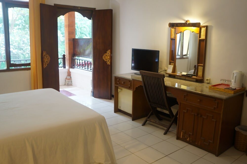 Фото Puri Naga Beachfront Cottages