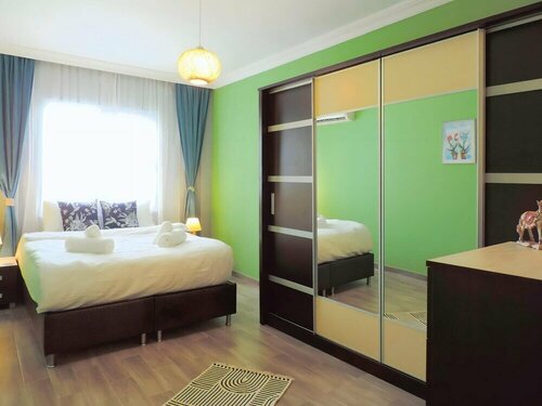 Апартаменты Centrally Located Flat 5 min to Ozdilekpark Mall в Муратпаше