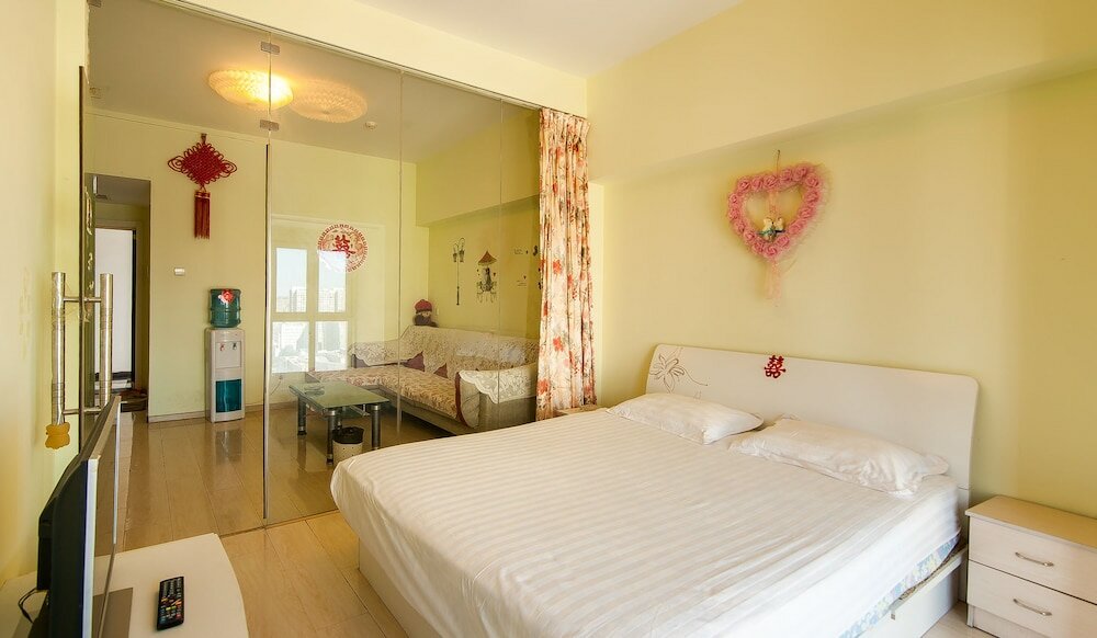 Фото Tianjin Xinyi Apartment Hotel