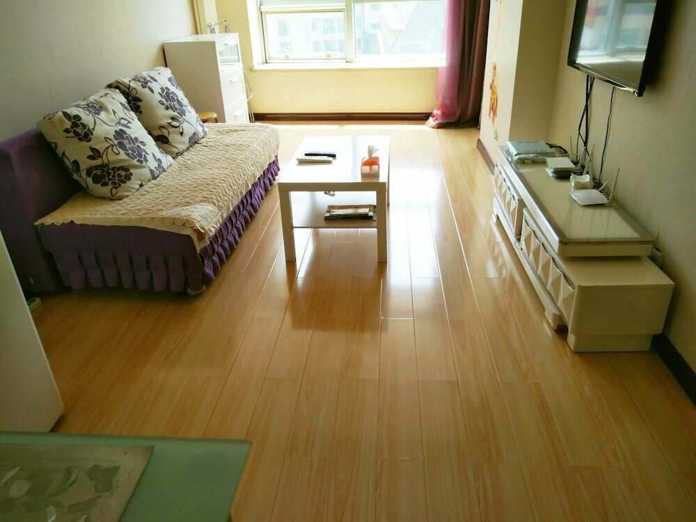 Фото Dalian Xiuzhu Building Apartment