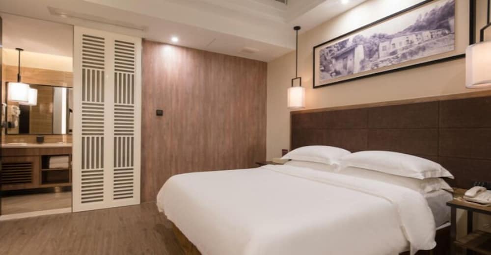 Фото Auden International Hotel