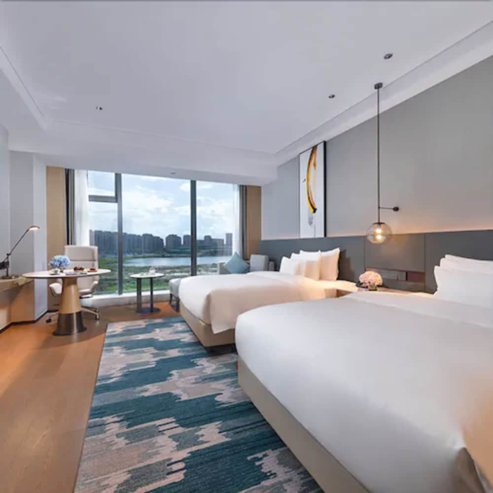 Фото New Century Hotel Zhenhai