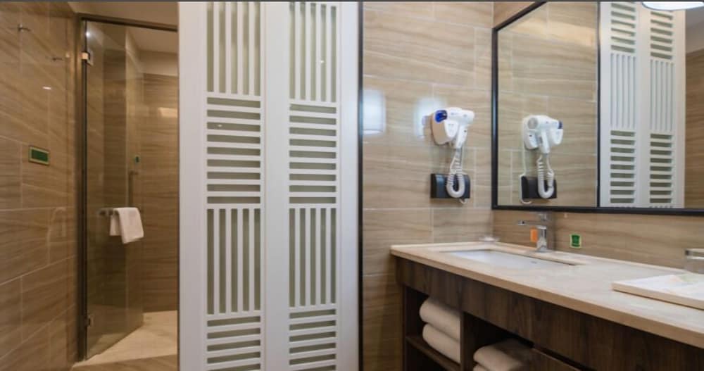 Фото Auden International Hotel