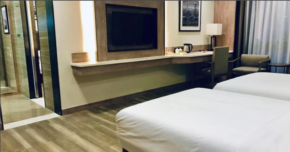 Фото Auden International Hotel