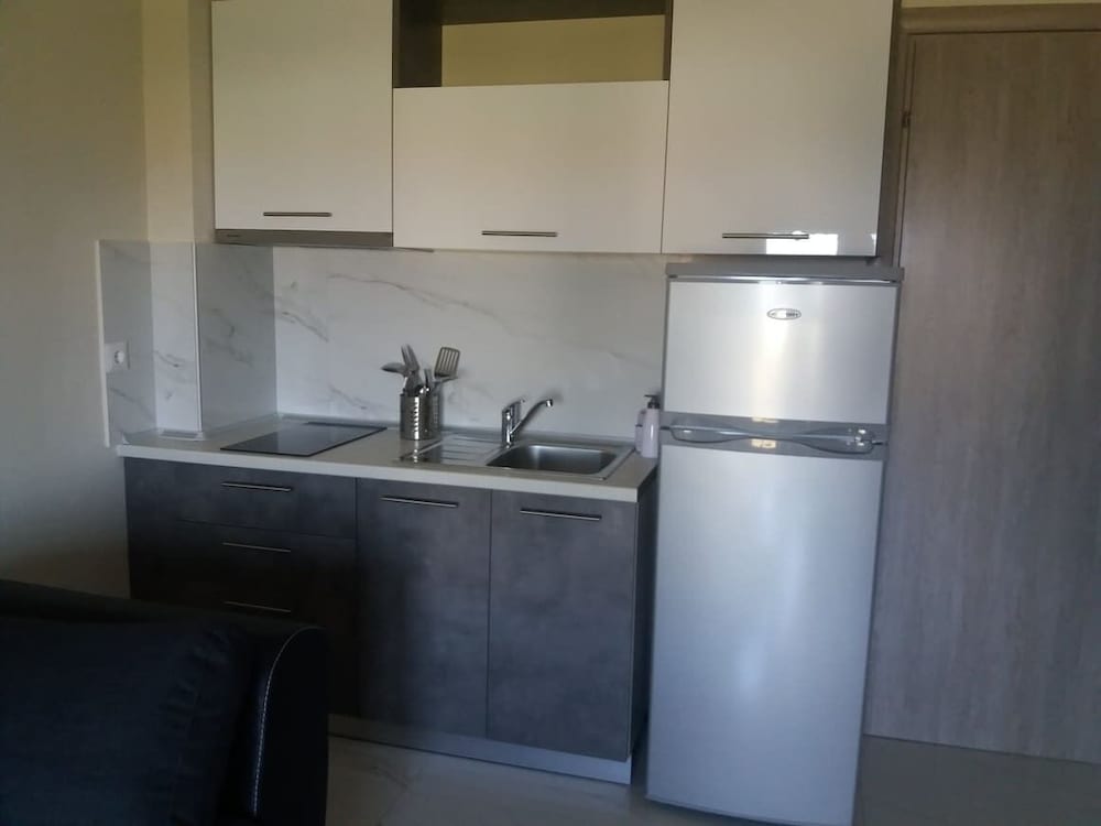 Фото Sinodinos Deluxe Apartments