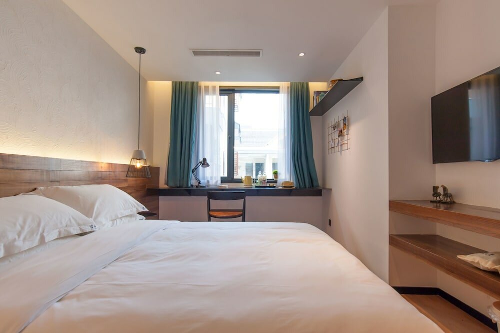 Фото Hangzhou Backlighting Inn