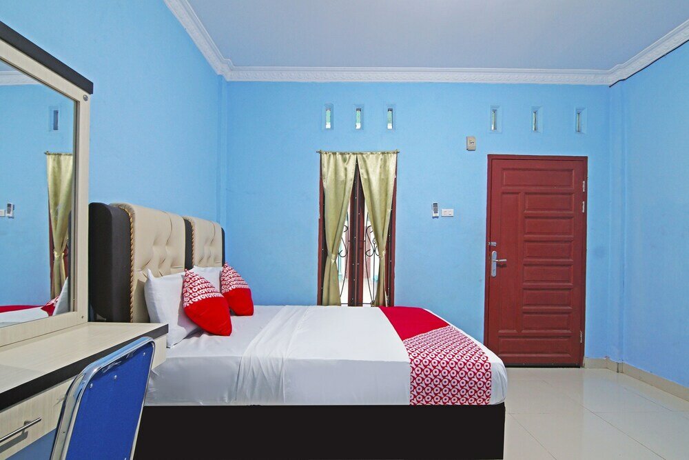 Фото Oyo 90752 Ridho Guest House Syariah
